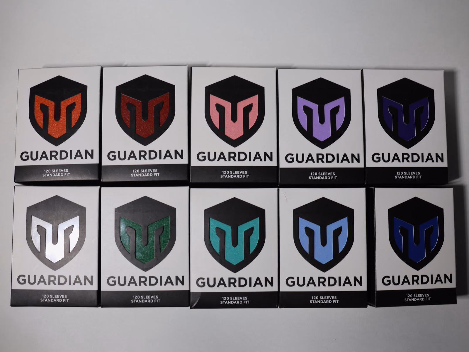 The full Guardian Sleeves colorway lineup laid out on a table